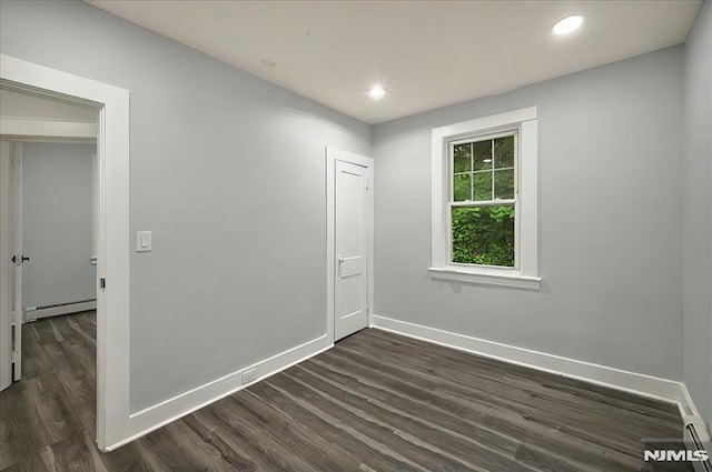 27 Berkeley Pl, Bloomfield, NJ 07003 - unfurnished room featuring a baseboard heating unit, dark wood-style flooring, baseboards, and recessed lighting