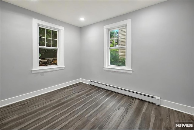27 Berkeley Pl, Bloomfield, NJ 07003 - empty room with a baseboard radiator, dark wood-style floors, baseboards, and recessed lighting