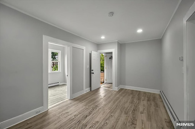 27 Berkeley Pl, Bloomfield, NJ 07003 - unfurnished room featuring a baseboard heating unit, baseboard heating, healthy amount of natural light, crown molding, and baseboards