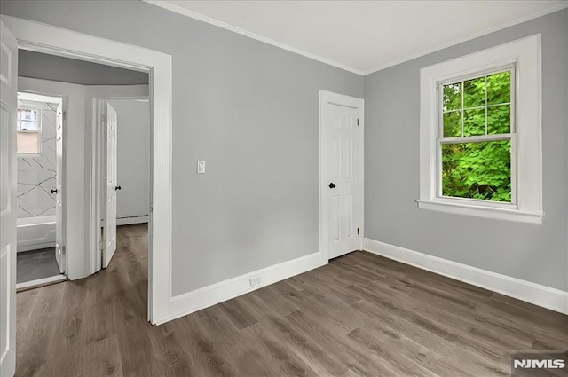 27 Berkeley Pl, Bloomfield, NJ 07003 - unfurnished bedroom featuring crown molding, wood finished floors, baseboards, a baseboard radiator, and a closet