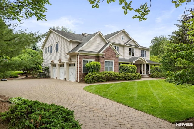 6 Lauren Pond Ct, Demarest, NJ 07627 - view of front of home featuring a garage, decorative driveway, brick siding, a front yard, and covered porch