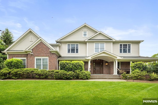 6 Lauren Pond Ct, Demarest, NJ 07627 - view of front of house with brick siding, a front lawn, and covered porch
