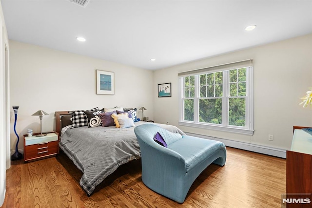 6 Lauren Pond Ct, Demarest, NJ 07627 - bedroom with wood finished floors, a baseboard heating unit, and recessed lighting