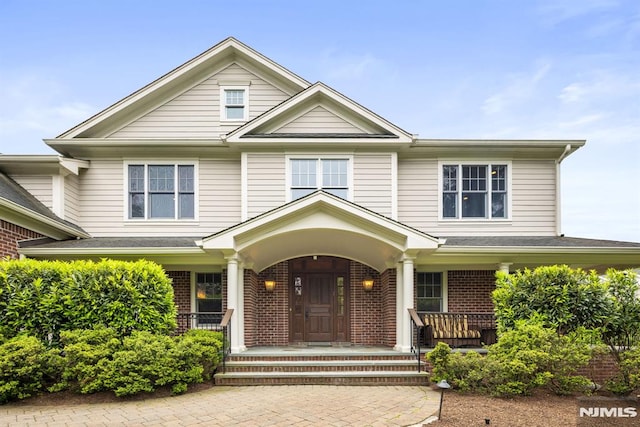 6 Lauren Pond Ct, Demarest, NJ 07627 - view of front of property with covered porch and brick siding