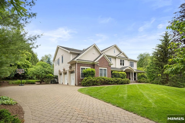 6 Lauren Pond Ct, Demarest, NJ 07627 - view of front of house featuring an attached garage, brick siding, decorative driveway, and a front lawn