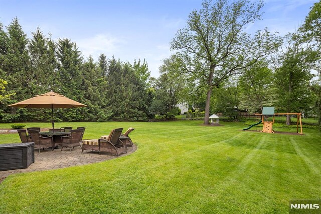 6 Lauren Pond Ct, Demarest, NJ 07627 - view of grassy yard with a patio and a playground