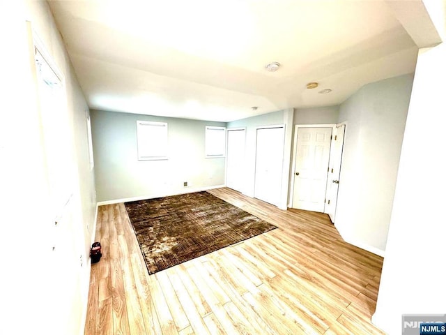 194 Elm Ave, Teaneck, NJ 07666 - unfurnished bedroom featuring multiple closets, wood finished floors, and baseboards