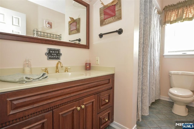 126 Darrow Dr, North Haledon, NJ 07508 - full bath with vanity, toilet, tile patterned flooring, baseboards, and a shower with shower curtain