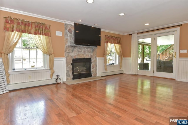 126 Darrow Dr, North Haledon, NJ 07508 - unfurnished living room with a baseboard radiator, crown molding, a wainscoted wall, a fireplace, and wood finished floors