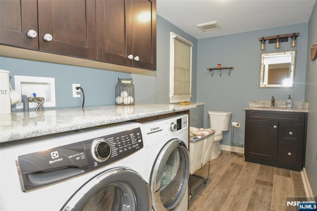 126 Darrow Dr, North Haledon, NJ 07508 - laundry area featuring washing machine and dryer, light wood-style floors, and baseboards