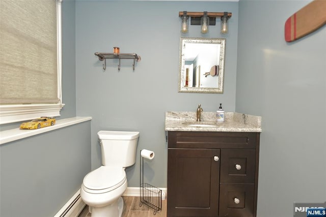 126 Darrow Dr, North Haledon, NJ 07508 - bathroom featuring vanity, toilet, a baseboard radiator, and baseboards