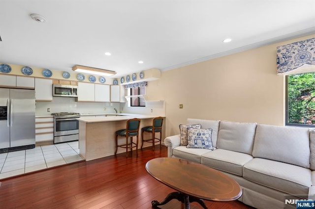 506 Teal Plz, Secaucus, NJ 07094 - living room featuring light wood finished floors, crown molding, and recessed lighting