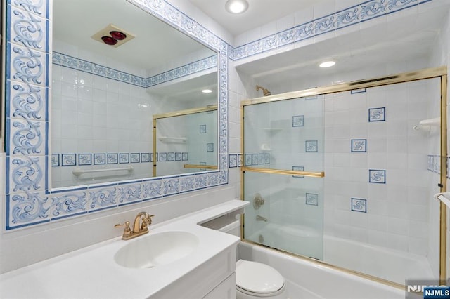 506 Teal Plz, Secaucus, NJ 07094 - bathroom with toilet, vanity, combined bath / shower with glass door, and recessed lighting