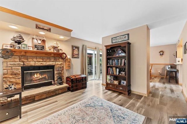 41 Sycamore Ave, Hillsdale, NJ 07642 - living area featuring wood finished floors, a stone fireplace, and baseboards