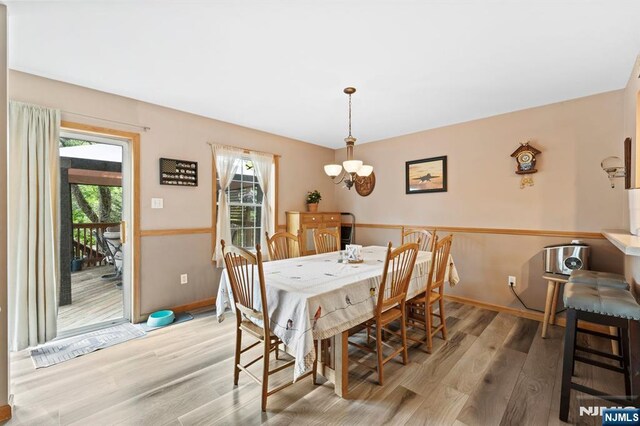 41 Sycamore Ave, Hillsdale, NJ 07642 - dining room featuring wood finished floors, plenty of natural light, and a chandelier