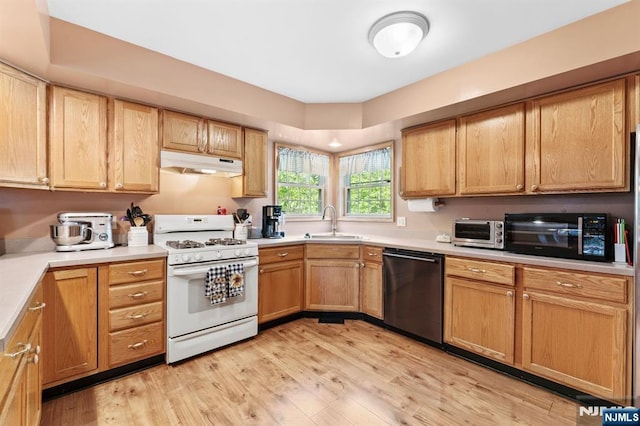 41 Sycamore Ave, Hillsdale, NJ 07642 - kitchen featuring white range with gas cooktop, dishwasher, under cabinet range hood, a sink, and black microwave
