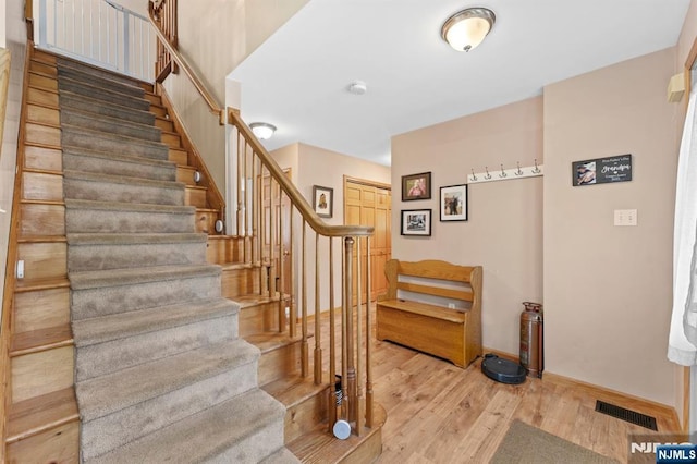 41 Sycamore Ave, Hillsdale, NJ 07642 - stairs featuring wood finished floors and baseboards