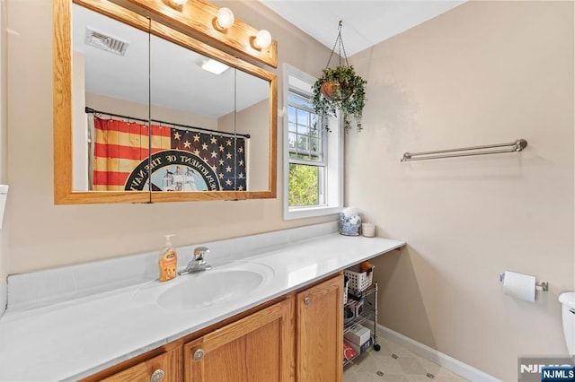 41 Sycamore Ave, Hillsdale, NJ 07642 - bathroom with vanity, baseboards, and toilet