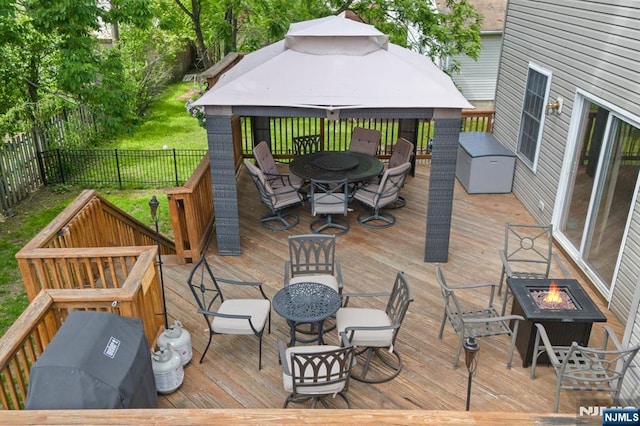 41 Sycamore Ave, Hillsdale, NJ 07642 - deck featuring an outdoor fire pit, a gazebo, outdoor dining area, and a fenced backyard