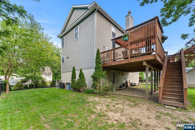 41 Sycamore Ave, Hillsdale, NJ 07642 - rear view of house with a deck and stairway