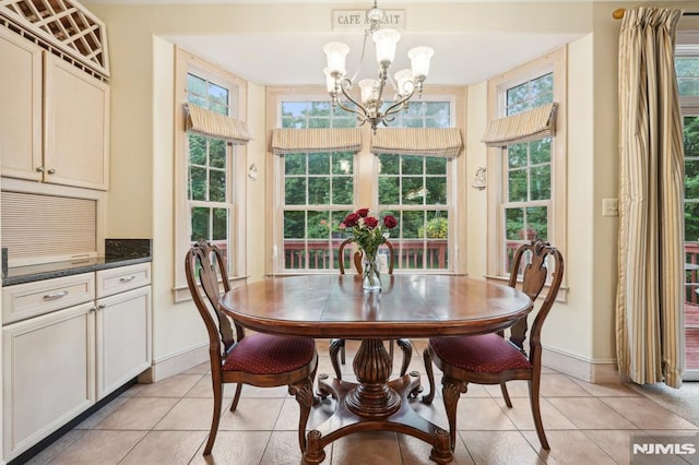 45 Dykers Farm Rd, North Haledon, NJ 07508 - dining area with a chandelier, baseboards, and light tile patterned floors