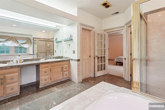 45 Dykers Farm Rd, North Haledon, NJ 07508 - ensuite bathroom with vanity, a stall shower, tile walls, a bathtub, and french doors