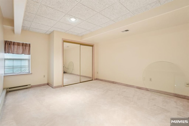 45 Dykers Farm Rd, North Haledon, NJ 07508 - unfurnished bedroom featuring carpet, baseboard heating, a closet, baseboards, and a drop ceiling