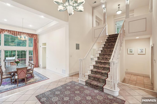 45 Dykers Farm Rd, North Haledon, NJ 07508 - stairs with a chandelier, tile patterned flooring, a towering ceiling, baseboards, and recessed lighting