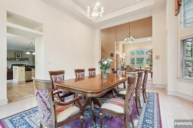 45 Dykers Farm Rd, North Haledon, NJ 07508 - dining room with a chandelier, stairway, a towering ceiling, light wood finished floors, and baseboards