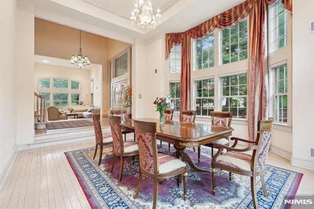 45 Dykers Farm Rd, North Haledon, NJ 07508 - dining room featuring a chandelier, a high ceiling, baseboards, hardwood / wood-style floors, and recessed lighting