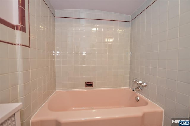 76 Spring Valley Rd, Montvale, NJ 07645 - bathroom featuring a bathtub and tile walls