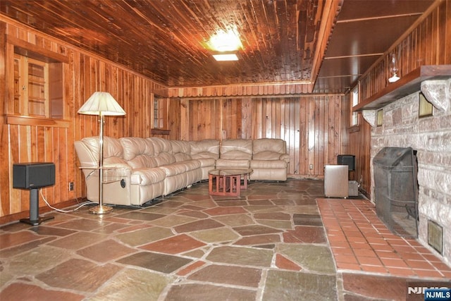 76 Spring Valley Rd, Montvale, NJ 07645 - living room featuring stone flooring, wooden walls, and wooden ceiling