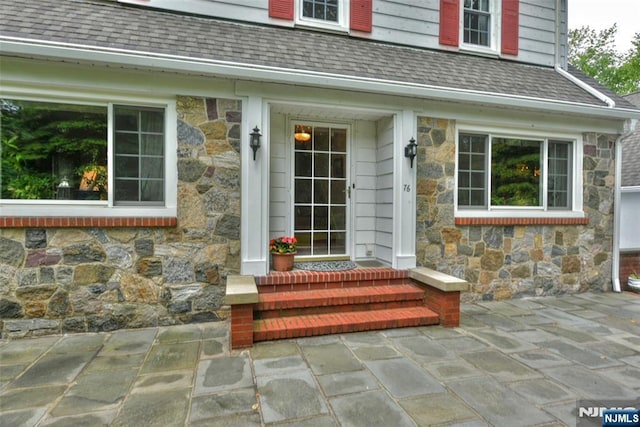 76 Spring Valley Rd, Montvale, NJ 07645 - doorway to property with stone siding and a shingled roof