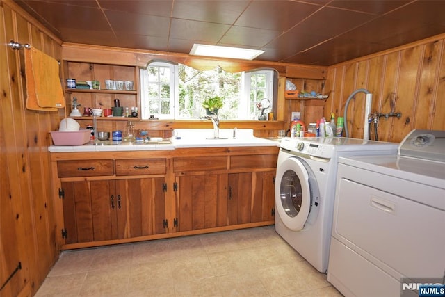 76 Spring Valley Rd, Montvale, NJ 07645 - laundry area featuring washing machine and clothes dryer, wooden walls, and cabinet space