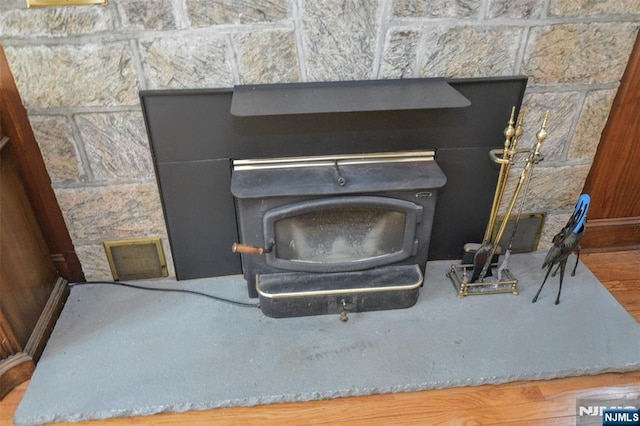 76 Spring Valley Rd, Montvale, NJ 07645 - detailed view of a wood stove and wood finished floors