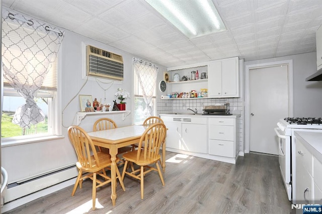 328-330 Hoover Ave, Bloomfield, NJ 07003 - dining room with baseboard heating, wood finished floors, and a wall unit AC