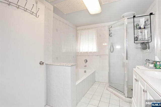 328-330 Hoover Ave, Bloomfield, NJ 07003 - full bathroom featuring a stall shower, vanity, tile patterned flooring, and a garden tub