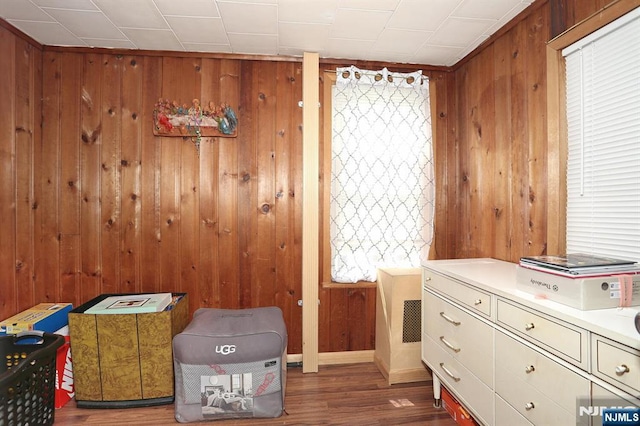 328-330 Hoover Ave, Bloomfield, NJ 07003 - bedroom with wood finished floors, wood walls, multiple windows, and baseboards