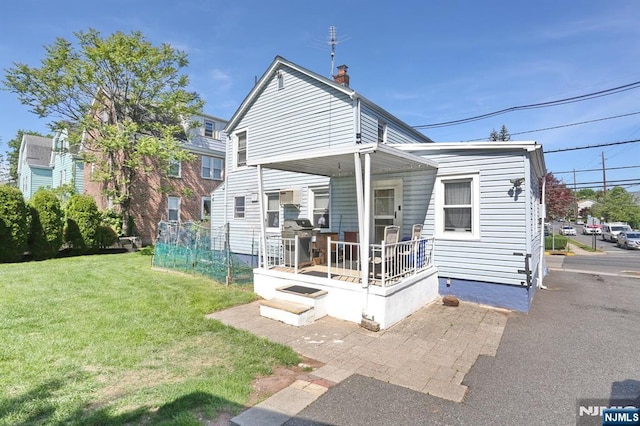 328-330 Hoover Ave, Bloomfield, NJ 07003 - back of property featuring a yard, a porch, and a chimney