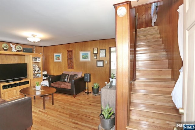 328-330 Hoover Ave, Bloomfield, NJ 07003 - living area with stairs, light wood-style floors, and wooden walls