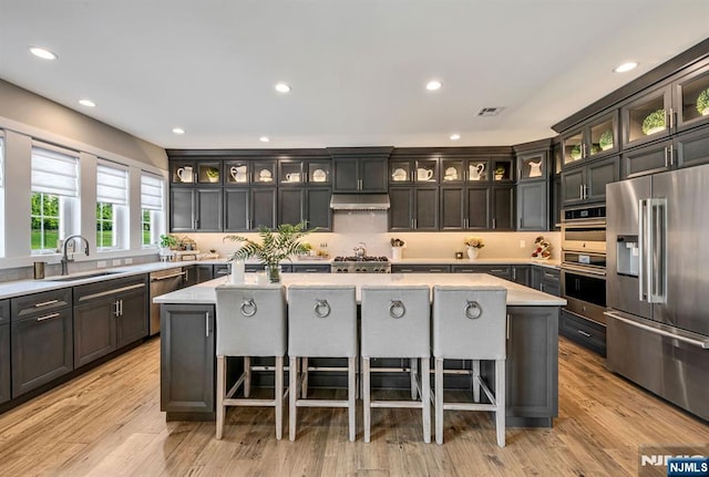 15 Meadowbrook Rd, Upper Saddle River, NJ 07458 - kitchen with appliances with stainless steel finishes, a sink, a center island, light countertops, and recessed lighting