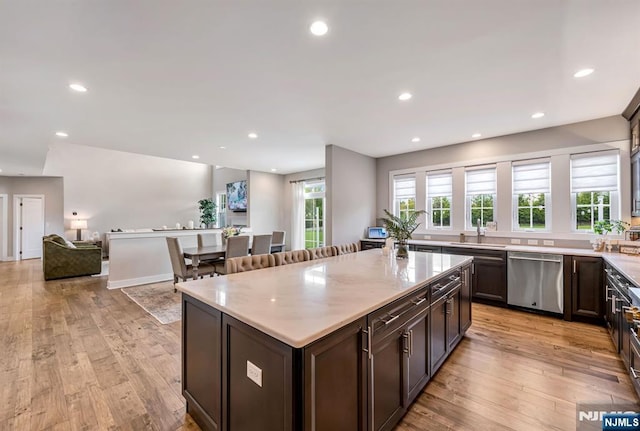 15 Meadowbrook Rd, Upper Saddle River, NJ 07458 - kitchen featuring stainless steel dishwasher, a sink, light wood finished floors, recessed lighting, and a center island