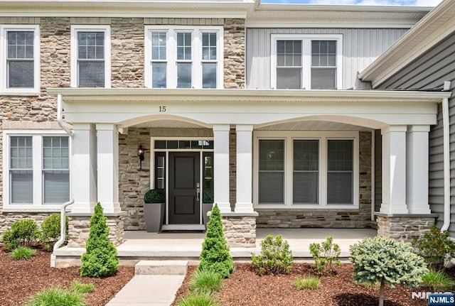 15 Meadowbrook Rd, Upper Saddle River, NJ 07458 - entrance to property featuring stone siding and a porch