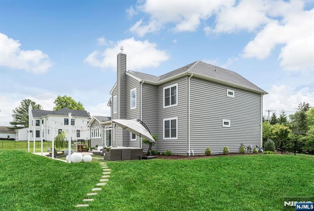 15 Meadowbrook Rd, Upper Saddle River, NJ 07458 - rear view of house featuring an outdoor hangout area, a chimney, and a patio area