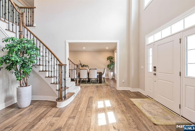 15 Meadowbrook Rd, Upper Saddle River, NJ 07458 - entryway featuring a towering ceiling, stairs, wood finished floors, and baseboards