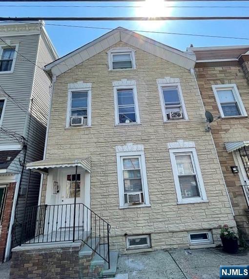 146 Adams St, Newark, NJ 07105 - townhome / multi-family property with stone siding and cooling unit