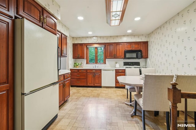 526 Cleveland Ave, River Vale, NJ 07675 - kitchen featuring white appliances, wallpapered walls, light countertops, a sink, and recessed lighting