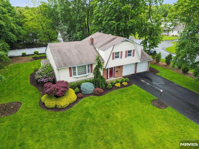 526 Cleveland Ave, River Vale, NJ 07675 - view of front of home featuring asphalt driveway, brick siding, roof with shingles, and a garage