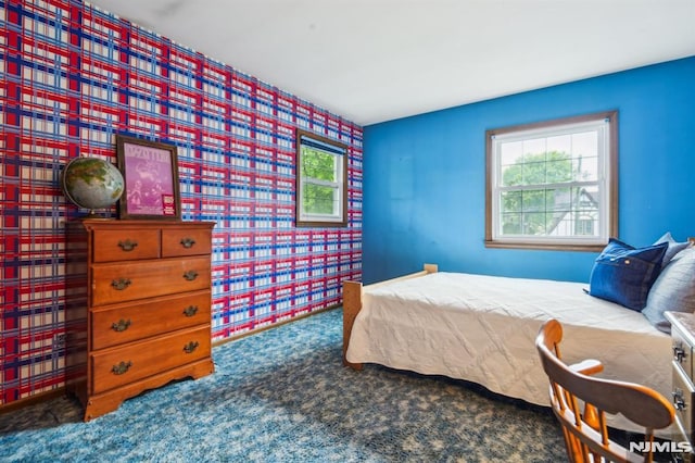 526 Cleveland Ave, River Vale, NJ 07675 - bedroom with multiple windows, carpet floors, wallpapered walls, and an accent wall