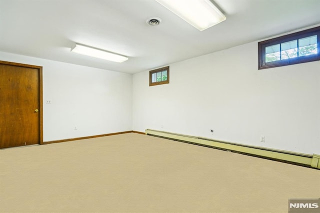 526 Cleveland Ave, River Vale, NJ 07675 - basement featuring a baseboard heating unit, carpet, and baseboards